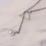 Simple geometric triangle pearl necklace